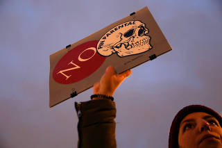 A protester holds a placard during a rally called by LGTBI organizations against a 'parental veto' on sex education, proposed by far-right party VOX, in Madrid
