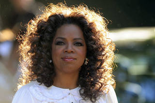 File photo shows U.S. talk show host Oprah Winfrey arriving for an event at Hyde Park in London