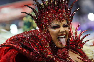 Drum queen Viviane Araujo from Mancha Verde samba school performs during the first night of the Carnival parade at the Sambadrome in Sao Paulo