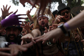 Revellers dance during carnival block party ?Unidos do Swing? in Sao Paulo