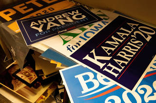 Campaign signs at Lori Ferber Collectibles in Scottsdale, Ariz. on Feb. 20, 2020. (Caitlin OÕHara/The New York Times)
