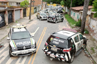 Military police vehicles are seen in front of their battalion during a police strike in Fortaleza