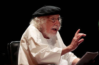 FILE PHOTO: Ernesto Cardenal speaks during a celebration for his 90th birthday at the National Theatre Ruben Dario in Managua