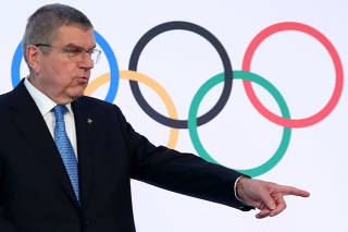 IOC President Bach attends a news conference in Lausanne