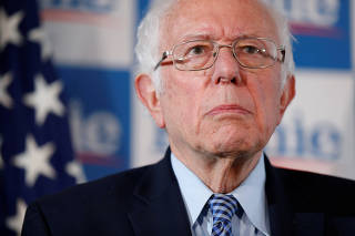 Senator Bernie Sanders looks on during a press conference at his campaign office in Burlington, Vermont