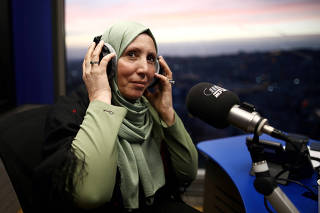 Iman Yassin Khatib, poised to become the first lawmaker in Israel's history to wear a hijab or head scarf, which she does as a Muslim, following results of her Arab Joint List party in Israel's election, participates in an interview in a radio show in Naz