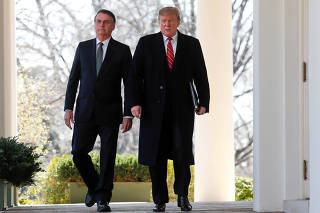 FILE PHOTO: U.S. President Donald Trump and Brazil's President Jair Bolsonaro hold a joint news conference at the White House in Washington