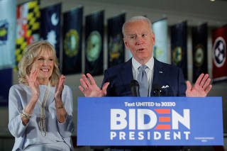 Democratic U.S. presidential candidate and former Vice President Joe Biden speaks with his wife Jill at his side during a primary night speech in Philadelphia