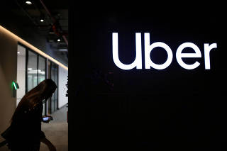 FILE PHOTO: Uber's logo is pictured at its office in Bogota