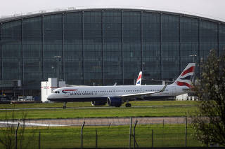 BA plane taxis near Terminal 5 at Heathrow Airport in London