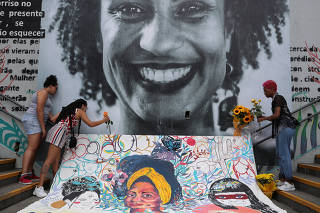 Women pay tribute to human rights activist and councilwoman Marielle Franco, to mark the second year of her murder, in Sao Paulo