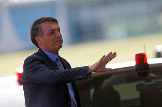 Brazil's President Jair Bolsonaro leaves Alvorada Palace in Brasilia