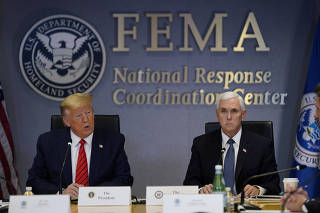 U.S. President Donald Trump and Vice President Mike Pence attend a meeting at the Federal Emergency Management Agency headquarters, in Washington