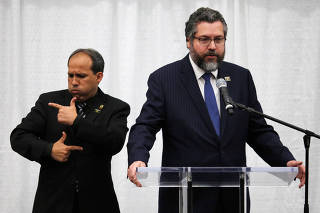 Brazilian Foreign Minister Ernesto Araujo speaks during a meeting with the Brazilian community at The Miami Dade College Auditorium, in Miami