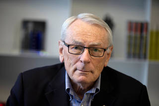 FILE PHOTO: International Olympic Committee (IOC) member Dick Pound poses in his offices in Montreal