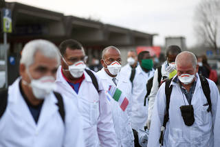 An emergency contingent of Cuban doctors and nurses arrive at Italy's Malpensa airport after travelling from Cuba to help Italy battle the spread of coronavirus disease (COVID-19), near Milan