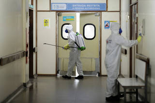 Members of the armed forces disinfect in a hospital during the coronavirus disease (COVID-19) outbreak in Brasilia