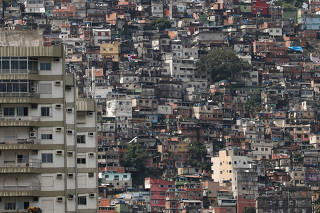 A view of the Rocinha slum, behind a residential building, amid the coronavirus disease (COVID-19) outbreak, in Rio de Janeiro