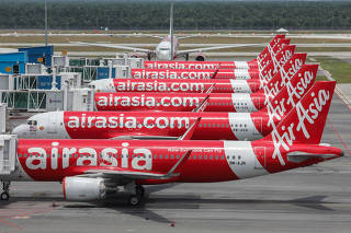 AirAsia planes are seen parked at Kuala Lumpur International Airport 2, during the movement control order due to the outbreak of the coronavirus disease (COVID-19), in Sepang