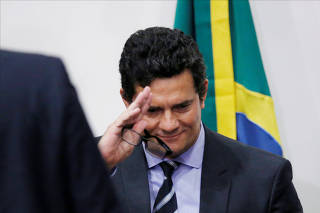 Brazil's Justice Minister Sergio Moro leaves a news conference in Brasilia