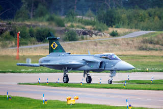 Handing over the first Saab Gripen E fighter to Brazil, in Linkoping