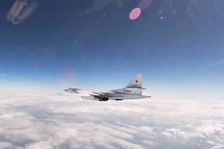 Russian Tu-160 strategic bomber flies over neutral waters of the Baltic Sea in this screen grab taken from handout video