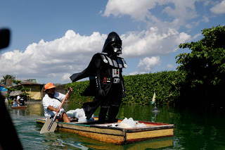 Village officer dressed as Darth Vader delivers relief goods amid coronavirus lockdown