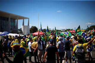 Supporters of far-right Brazilian President Jair Bolsonaro take part in a protest, in Brasilia