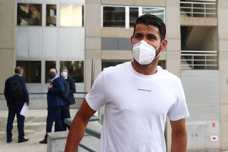 Atletico Madrid's Diego Costa arrives at a court to attend a trial for tax fraud