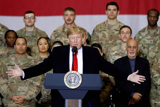 FILE PHOTO: U.S. President Donald Trump makes an unannounced visit to U.S. troops at Bagram Air Base in Afghanistan