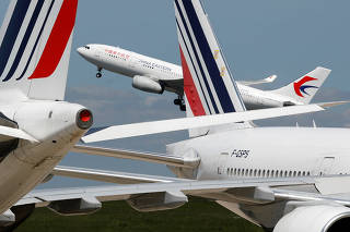FILE PHOTO: Airplanes at Paris Charles de Gaulle airport in Roissy-en-France