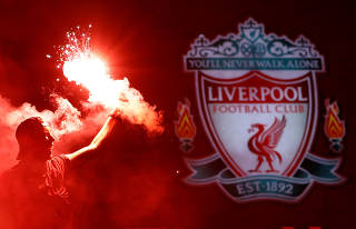 Premier League - Liverpool fans celebrate winning the Premier League