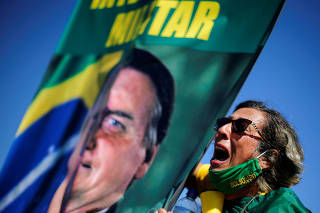 A demonstrator takes part in a protest in support of Brazilian President Jair Bolsonaro, amid the coronavirus disease (COVID-19) outbreak, in Brasilia