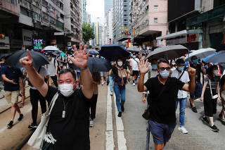 Anti-national security law protesters march at the anniversary of Hong Kong's handover to China from Britain in Hong Kong