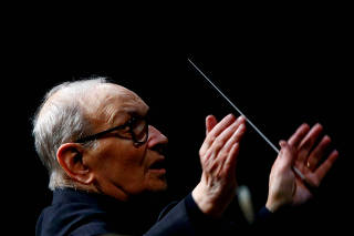 FILE PHOTO: Italian composer Ennio Morricone conducts a concert in Berlin