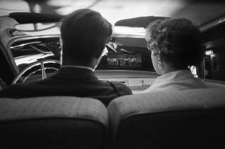 A couple watches a film at the Bayshore-Sunrise Drive-In in Bay Shore, N.Y., May 28, 1955. (Sam Falk/The New York Times)