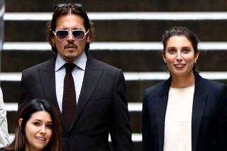 Actors Johnny Depp and Amber Heard at the High Court in London