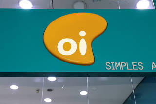 FILE PHOTO: The logo of Brazilian telecoms company Oi SA is pictured inside a store in Sao Paulo