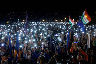 People take part in a protest for media freedom in Budapest