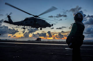 Sea Hawk helicopter launches during flight operations aboard the U.S. Navy aircraft carrier USS Ronald Reagan in the South China Sea