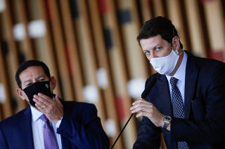 Brazil's Environment Minister Ricardo Salles speaks next Brazil's Vice President Hamilton Mourao during a news conference at the Itamaraty Palace in Brasilia