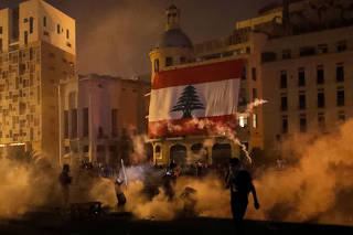 Tear gas is fired by police towards demonstrators during a protest following Tuesday's blast, in Beirut