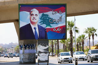 A billboard depicting Lebanon's former Prime Minister Rafik al-Hariri, who was killed in a bombing in 2005, is pictured in Sidon
