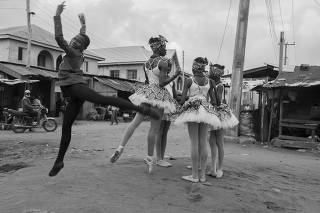 Anthony Mmesoma Madu, left, with fellow students from the Leap of Dance Academy, in Lagos, Nigeria, Aug. 1, 2020. (Stephen Tayo/The New York Times)