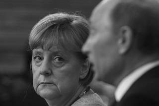 File photo of Russia's President Putin and Germany's Chancellor Merkel attending a news conference in St. Petersburg