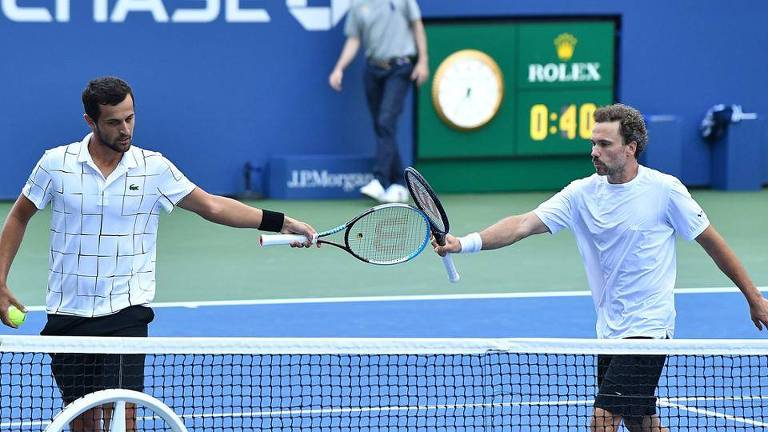 Bruno Soares (à dir.) ao lado do croata Mate Pavic na semifinal do US Open