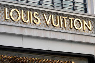 FILE PHOTO: Louis Vuitton logo outside a store in Paris