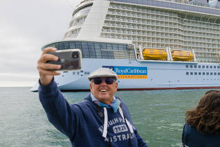 Ferry passengers line up to take selfies, as if they had just spotted a celebrity, in Bournemouth, England on Sept. 8, 2020. 
(Guy Martin/The New York Times)