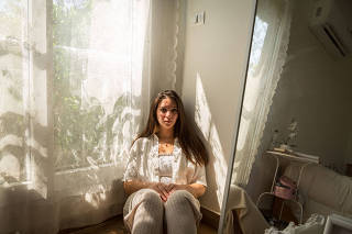 Nadeen Ashraf, at home in Cairo, Sept. 14, 2020, created an Instagram page naming a man accused of being a sexual harasser. (Sima Diab/The New York Times)