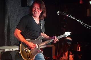 FILE PHOTO: Guitarist Eddie Van Halen performs during a private Van Halen show to announce the band's upcoming tour at Cafe Wha? in New York
